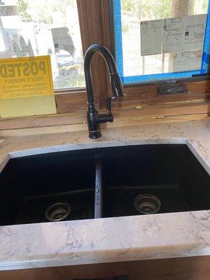 My black sink and quartz counter