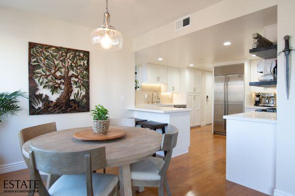 Custom Cabinetry, Quartz Countertops, State-of-the-Art Appliances, Lighting, and Dining Area.