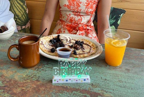 One of the decorations on the table with the Nutella & fruit pancakes and fresh squeezed orange juice