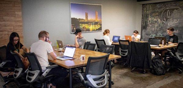 Coworking members in the back flex space at Outlet Coworking