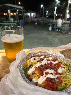 Hofbräuhaus beer and low car burrito bowl from the taco truck. View of outdoor seating area from indoors.