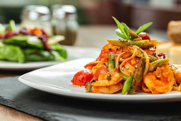 Spaghetti with Shrimp, Asparagus, Cherry Tomato and garlic in a light tomato sauce Special