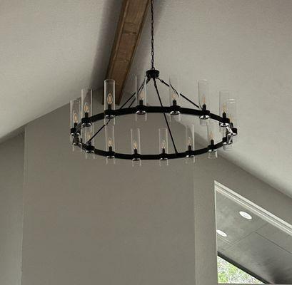 Installed chandelier in vaulted ceiling.