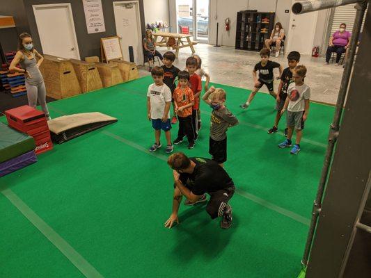 Our kids learning the Parkour Roll, one of the basic safety skills for developing a safe practice.