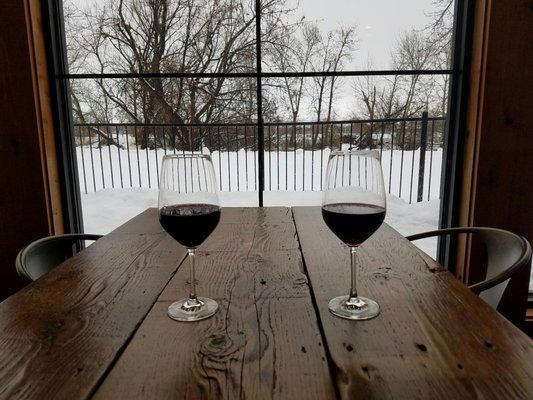 Glass of wine on a snowy winter afternoon