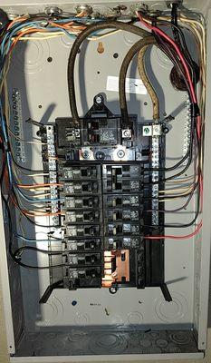 Initial circuit box and wiring installation.  Main wiring to outside electric meter box was done in second visit.