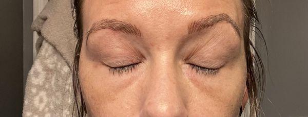 Visible that either brow is perpendicular nor the same.