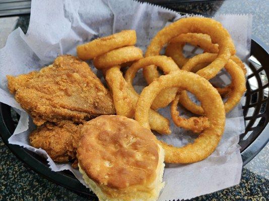 2 piece fried chicken with a side of onion rings