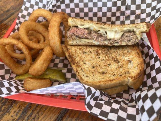 The patty melt and onions rings look a lot better than they were.