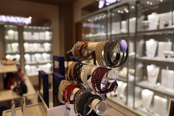 Swarovski Crystal accessories and jewelry, name brand purses and more at Quill Boutique.