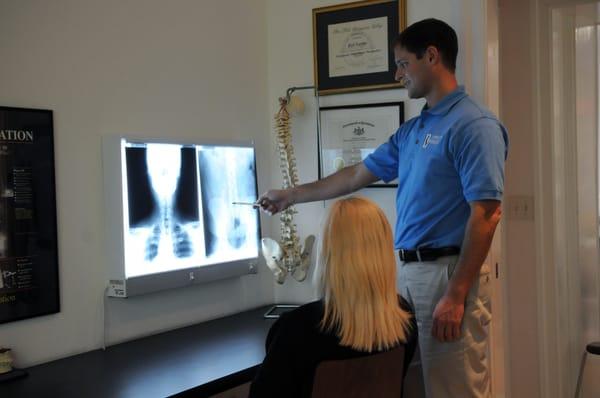 Dr. Laurence reviewing radiographs with a new patient