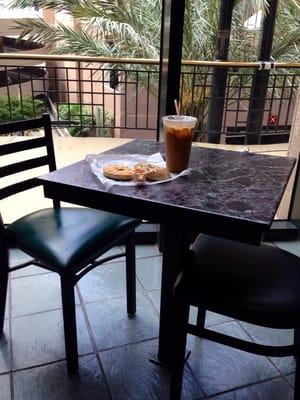 SESAME BAGEL, IN-HOUSE ROASTED TOMATO SCHMEAR, ICED COFFEE: $6; at my favorite 2-top upstairs in the food court Gravier side.