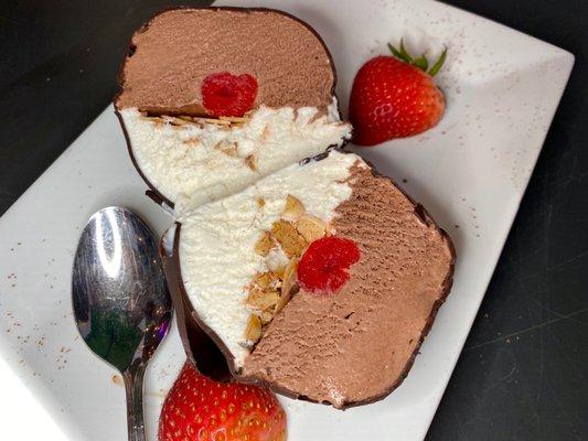 Tartufo Great dessert to share. Chocolate and vanilla ice cream with cherry center and hard chocolate coating.