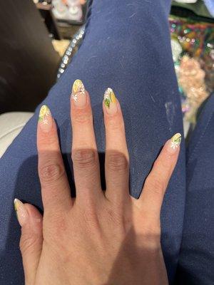 Tina from idol nails put lemons on my nails for a summer look. Each nail is different.