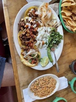 Mini tacos (chicken fajita meat) plate with Mexican rice instead of beans.