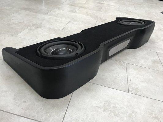 Custom made box for 2 Rockford power 10" subs under the rear seats in 2017 GMC truck.