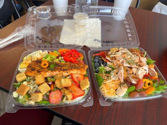 House Standard Size Salads With Lots Of Toppers. The Protein On One Was Salmon & The Other Was Chicken.