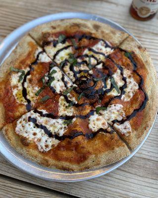 Margherita pizza with a balsamic drizzle