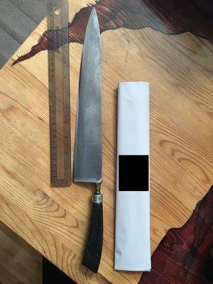 Knife as it was found with glued on plastic handle.