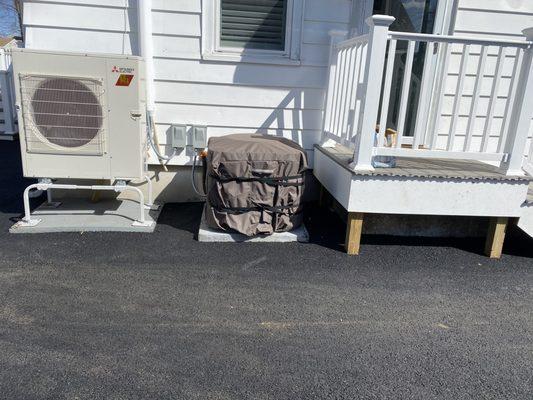 Nestled the asphalt neatly around the heating and ac units.