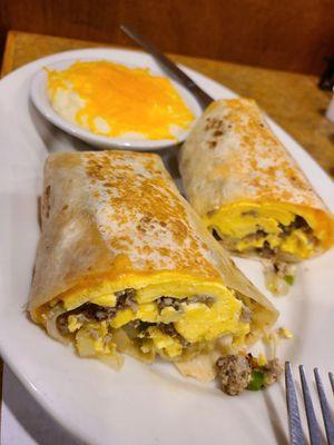 Breakfast burrito and grits with cheese