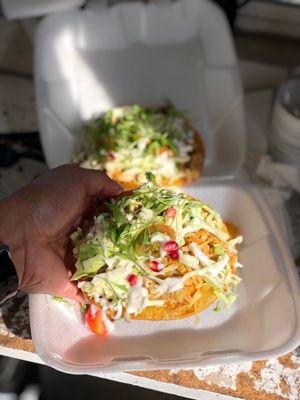 Vegan Jackfruit tostadas topped with vegan sour cream greens & pomegranate