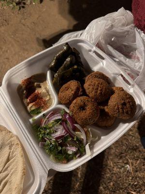 Falafel and dolma with salad and hummus.