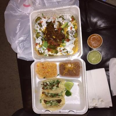 Fiesta nachos with Al pastor on top. And the taco plate which comes with three tacos, rice, and beans.