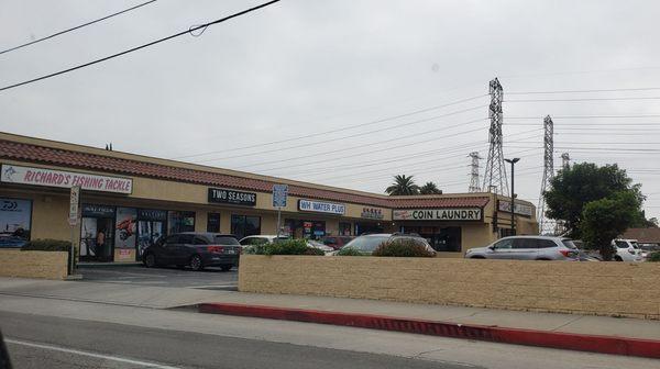 Rainbow Hair Stylist is located to the left of Coin Laundry