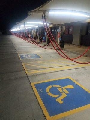 Handicap detailing stations with lowered detailing equipment like vacuuming and air nozzles