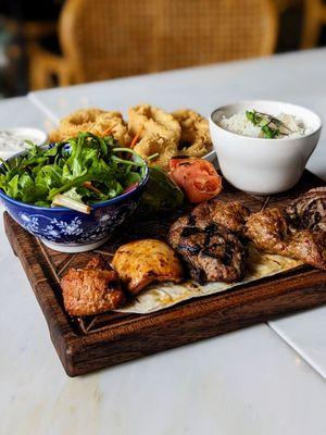 Mixed grill meat entree and calamari appetizer.