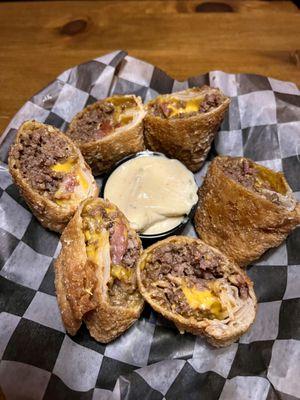 Cheeseburger Rolls-Three handmade rolls stuffed with seasoned Beef, Bacon, and American cheese