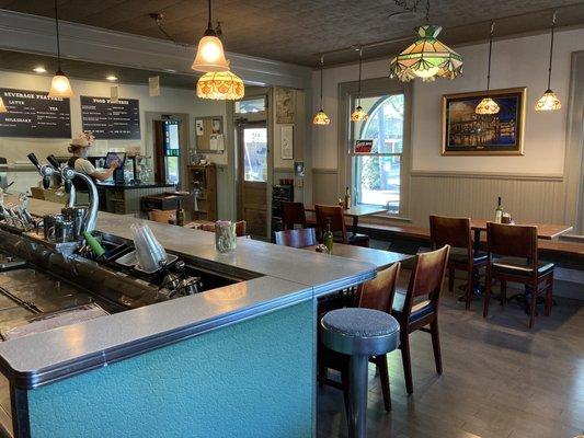 Cute interior utilizing an old fashioned soda shop or diner counter.