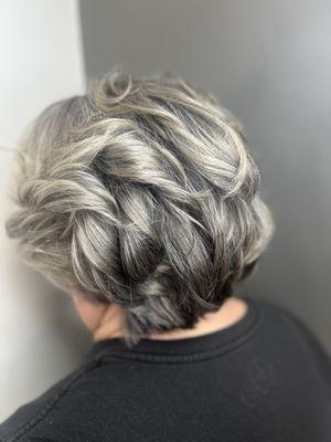 Embracing the gray with an all over highlight and A nice layered cut to complement it.