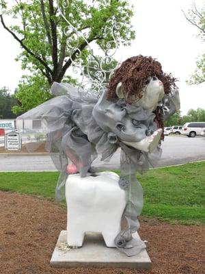 Cuspid, our Bulldog Tooth Fairy, greets all of our patients!