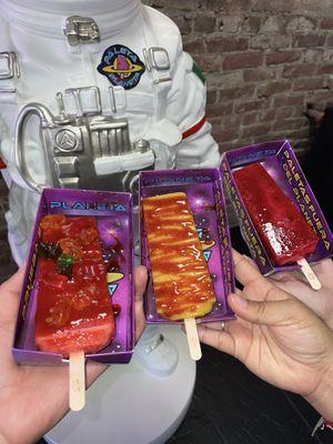 Strawberry Watermelon with chamoy and gummy bears, Mango Guanabana paleta with chamoy and Jamaica paleta