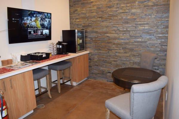 Waiting area  with flat screen TV.