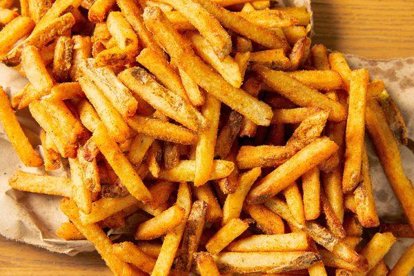 A close-up view of regular order of Five Guys fries.