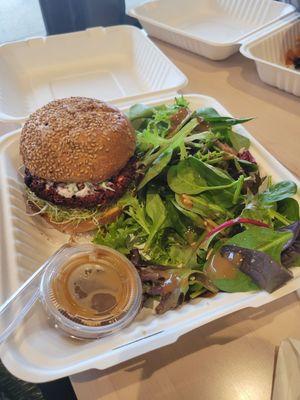 Beet and mushroom veggie burger with side salad