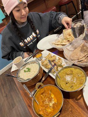 Momos, naan, butter chicken, coconut curry