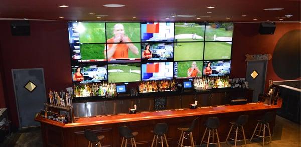 Huge wall of TVs behind the bar at Smitty's in Riverhead!