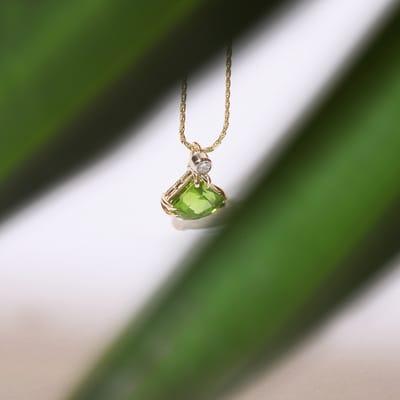 Swimming in the eternal facets of a natural peridot stone. http://bigislandjewelers.com/product/peridot-pendant-2/ Big Island Jewelers