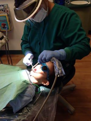 Happily getting his teeth polished.