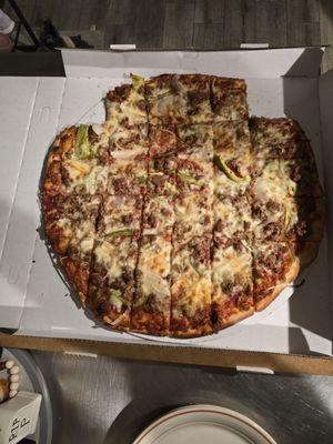 Thin crust pizza. Sausage,  onion and green pepper