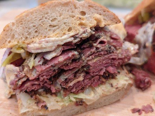 CRUST HOT PASTRAMI - Double Pastrami, melted cheese, pepperoncini, lettuce, onions, spread. Exclusively at CRUST San Jose