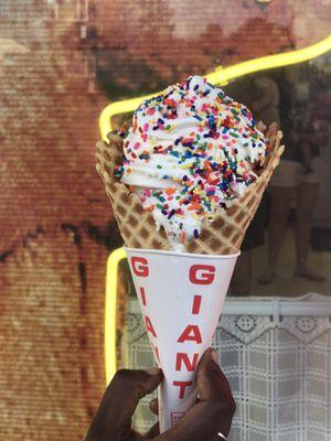 Under all that amazing yummy soft serve is hard scoops of cookie and cream, and yes that's a gigantic waffle cone