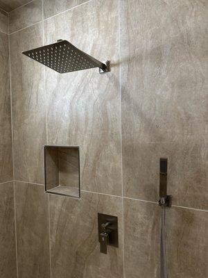 Custom shower: Mosaic floor, 24" x 48" Large format, New shower valves, Reroute plumbing, linear shower drain, New glass door.