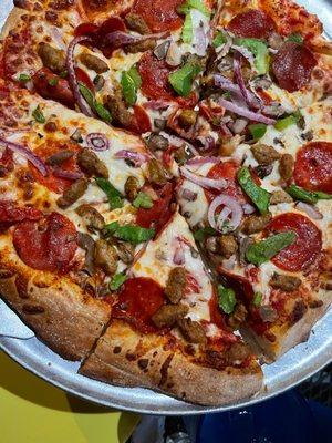 Pizza with pepperoni,peppers,onions