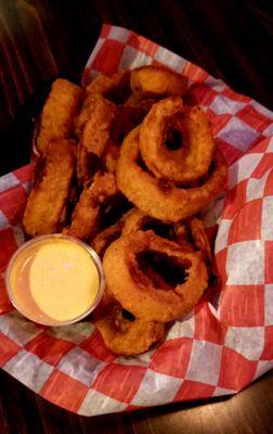 Onion rings with a spicy horseradish dipping sauce.