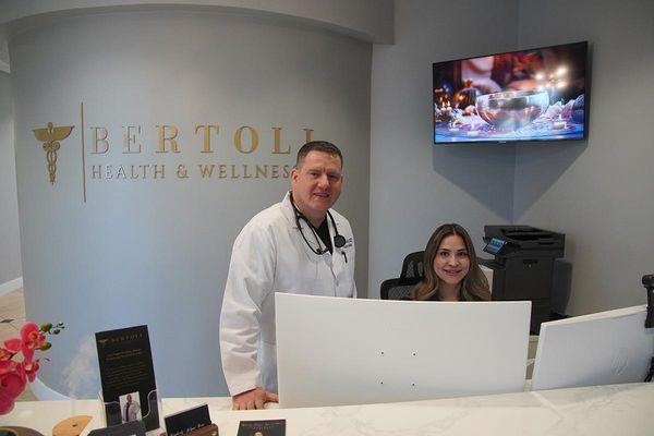 Dr. Troy Bertoli and Vanessa behind the front counter